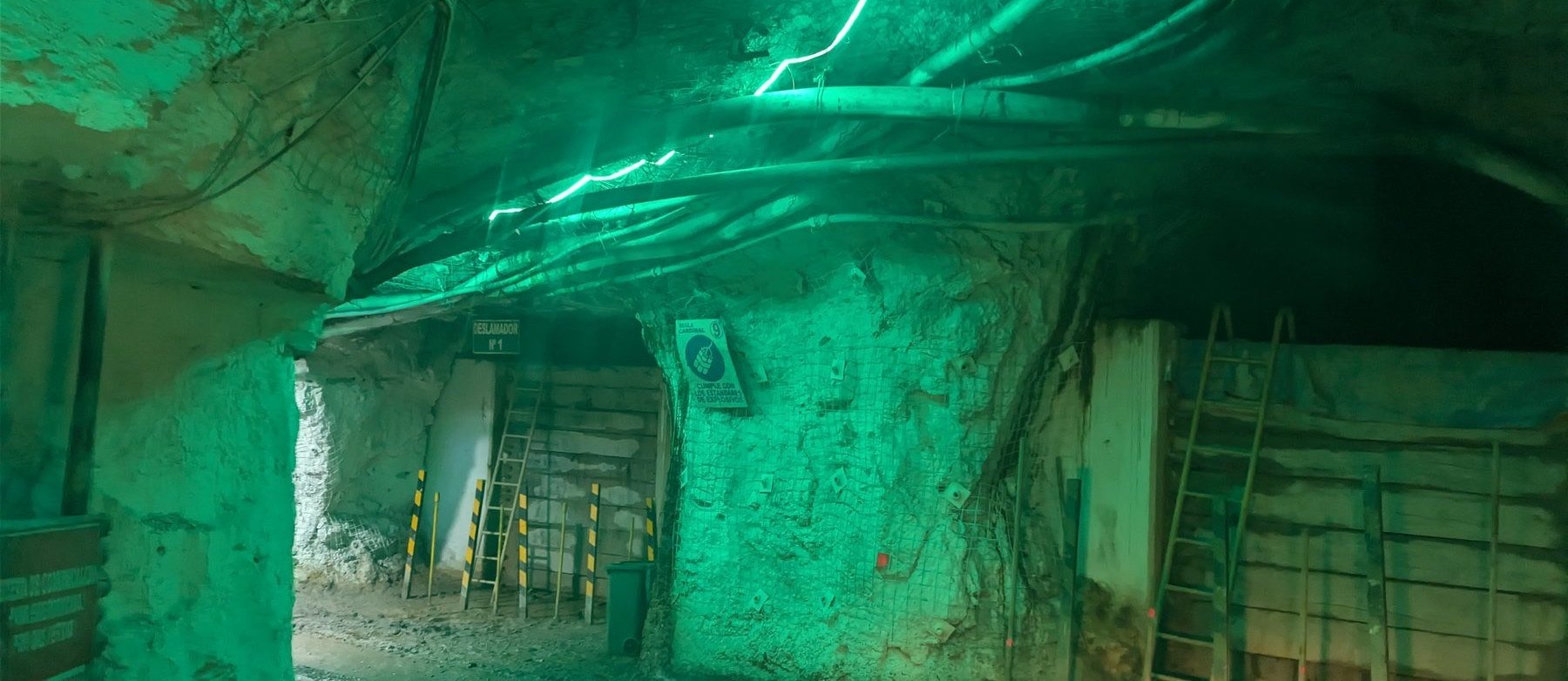 Underground mine tunnel, lit green